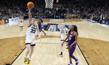Caitlin Clark #22 of the Iowa Hawkeyes shoots the ball over Angel Reese #10 of the LSU Tigers during the first half in the Elite Eight round of the NCAA Women's Basketball Tournament at MVP Arena on April 1 in Albany