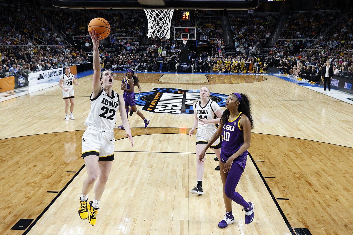 <i>Sarah Stier/Getty Images via CNN Newsource</i><br/>Caitlin Clark #22 of the Iowa Hawkeyes shoots the ball over Angel Reese #10 of the LSU Tigers during the first half in the Elite Eight round of the NCAA Women's Basketball Tournament at MVP Arena on April 1 in Albany