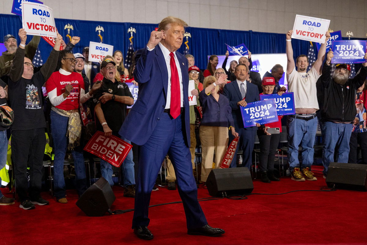 <i>Mike Roemer/AP via CNN Newsource</i><br/>Republican presidential candidate former President Donald Trump takes to the stage before speaking on April 2 in Green Bay