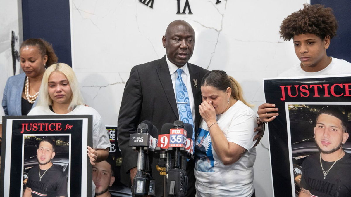 <i>Willie J. Allen Jr./Orlando Sentinel/Tribune News Service/Getty Images via CNN Newsource</i><br/>Attorney Ben Crump holds Yaneri Diaz Rodriguez as she cries during a news conference about the killing of her son