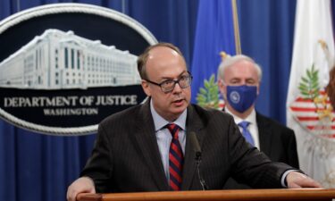 Then-Acting Assistant US Attorney General Jeffrey Clark speaks next to Deputy US Attorney General Jeffrey Rosen at a news conference. An attorney discipline panel in Washington