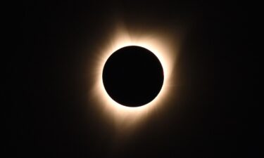 The sun's corona is visible as the moon passes in front of the sun during a total solar eclipse at Big Summit Prairie ranch in Oregon's Ochoco National Forest near the city of Mitchell on August 21