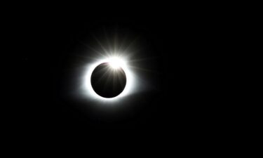 Spectators watch the eclipse on Monday