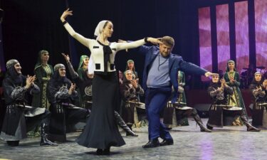 Chechen President Ramzan Kadyrov (in blue suit) dances to folk music in Grozny