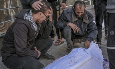 People mourn outside Al-Shifa hospital in Gaza City over one of the Palestinians killed during the aid delivery on February 29.