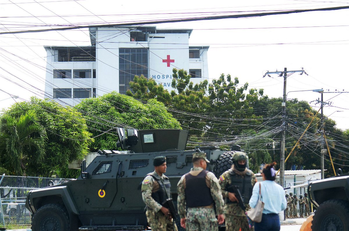 <i>Gerardo Menoscal/AFP/Getty Images via CNN Newsource</i><br/>Army soldiers guard the surroundings of the Naval Hospital of Guayaquil