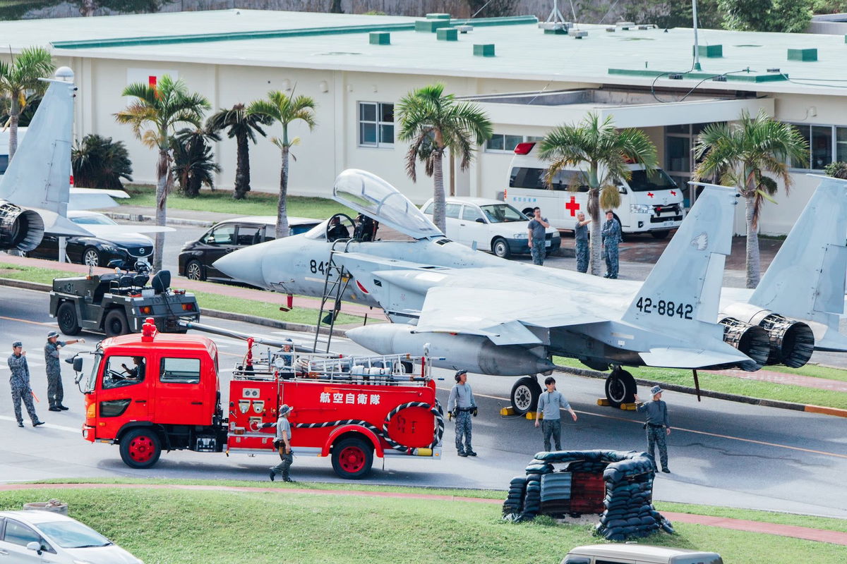 <i>Naha Air Base via CNN Newsource</i><br/>Aircraft tugs pulled the fighter jets on to a road at Naha Air Base on Okinawa to be sure they were not damaged in a possible tsunami.