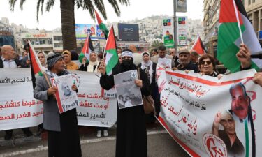 People protest following the death in an Israeli jail of terminally ill Palestinian activist and novelist Walid Daqqa