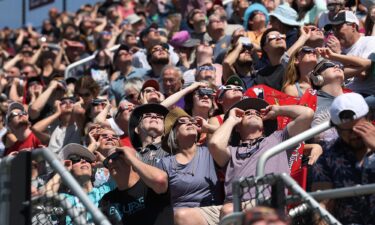 People view the start of the total eclipse on the campus of Southern Illinois University on April 8