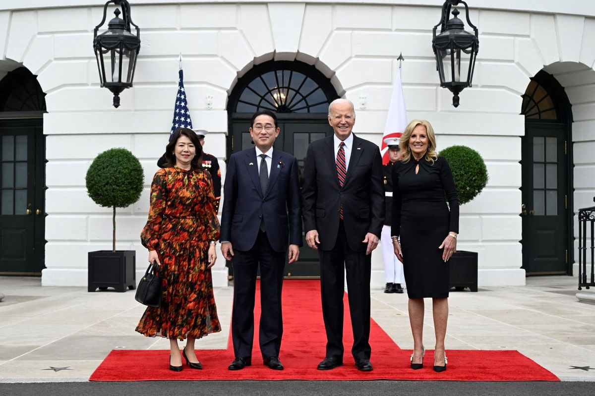 <i>Andrew Caballero-Reynolds/AFP/Getty Images via CNN Newsource</i><br/>President Joe Biden and first lady Jill Biden welcome Japan's Prime Minister Kishida Fumio and his spouse Kishida Yuko are pictured at the South Portico of the White House in Washington