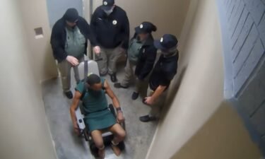 A surveillance video showing a jailer wrapping a chain around the neck of an inmate whose attorneys say was briefly choked.