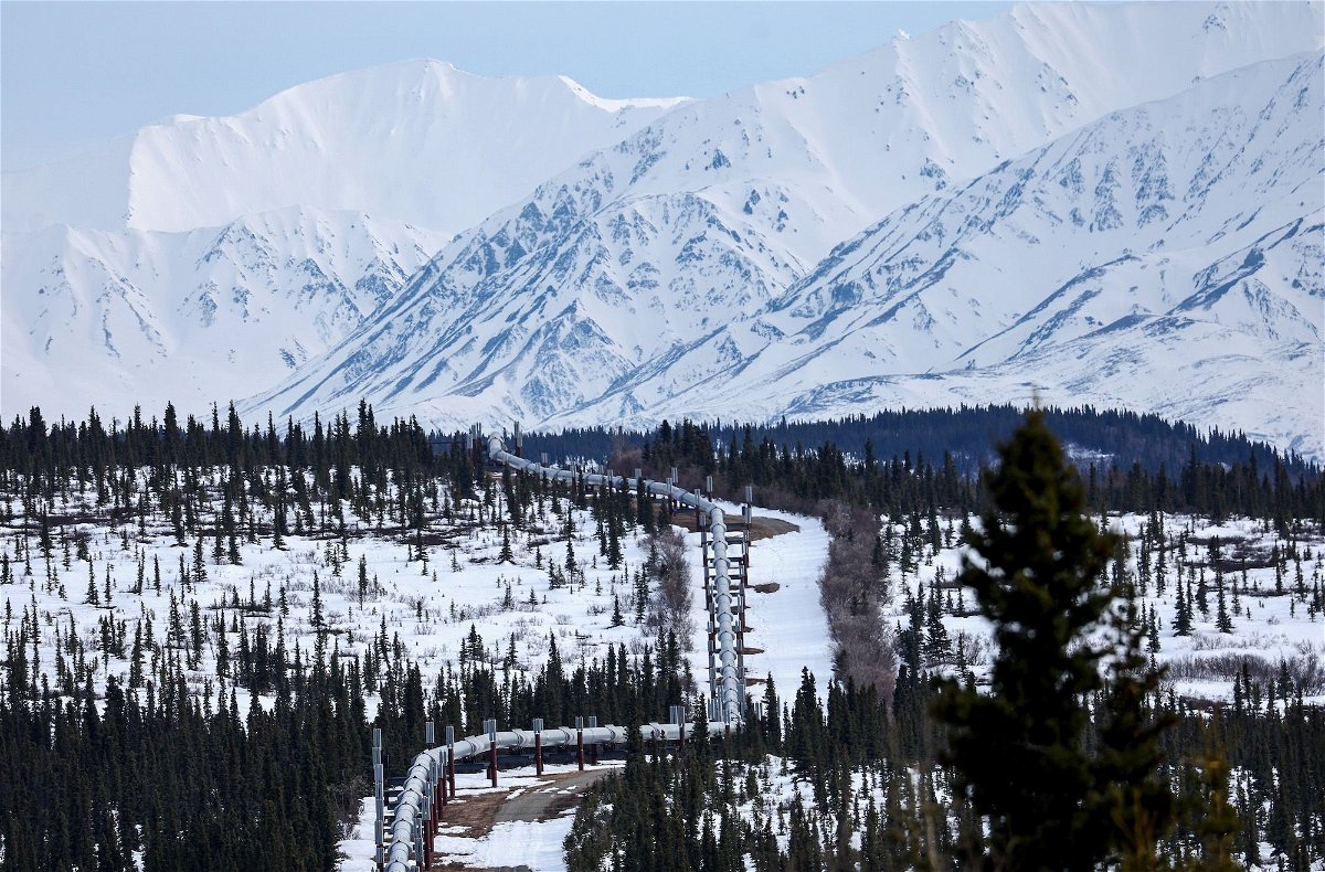 <i>Mario Tama/Getty Images via CNN Newsource</i><br/>A part of the Trans Alaska Pipeline System runs through boreal forest past Alaska Range mountains in May 2023 near Delta Junction