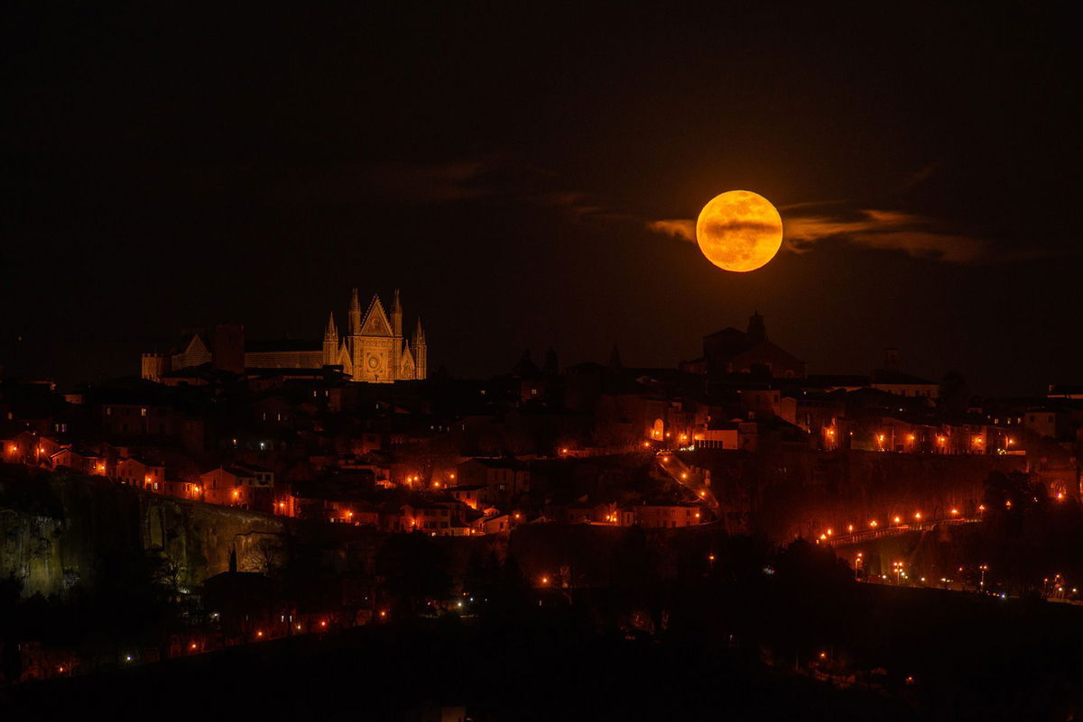 <i>Lorenzo Di Cola/NurPhoto/Getty Images via CNN Newsource</i><br/>The pink moon rises next to Orvieto Cathedral in the region of Umbria in Italy