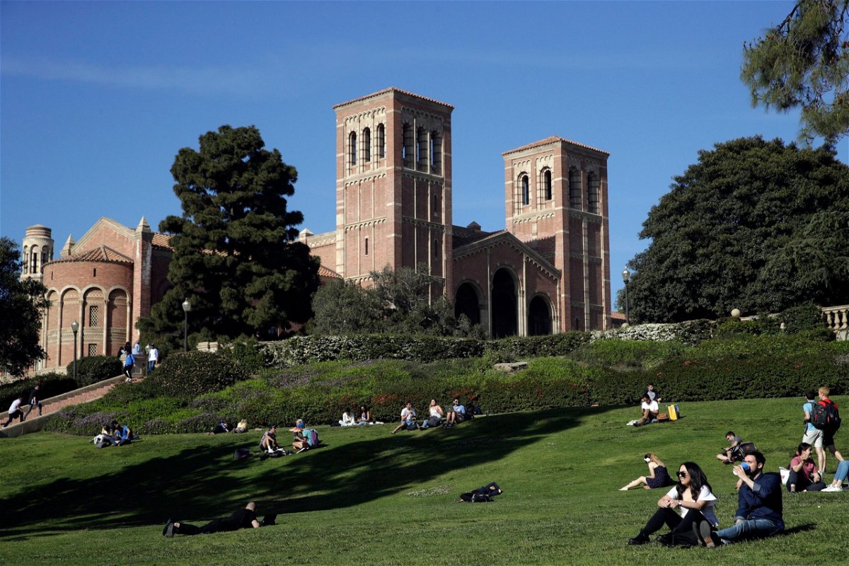 <i>Jae C. Hong/AP via CNN Newsource</i><br/>Students sit on the lawn near Royce Hall at the University of California
