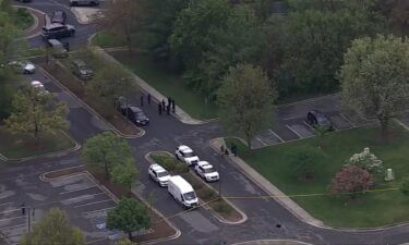 Law enforcement appear on the scene of a shooting in Greenbelt