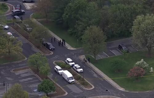 Law enforcement appear on the scene of a shooting in Greenbelt