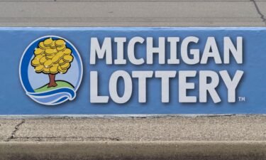 The Michigan Lottery logo is seen at the Michigan International Speedway in August 2023.
