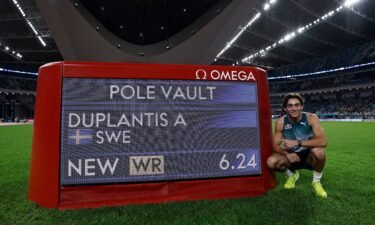 Sweden's Armand Duplantis celebrates after winning the men's pole vault and setting a new world record.