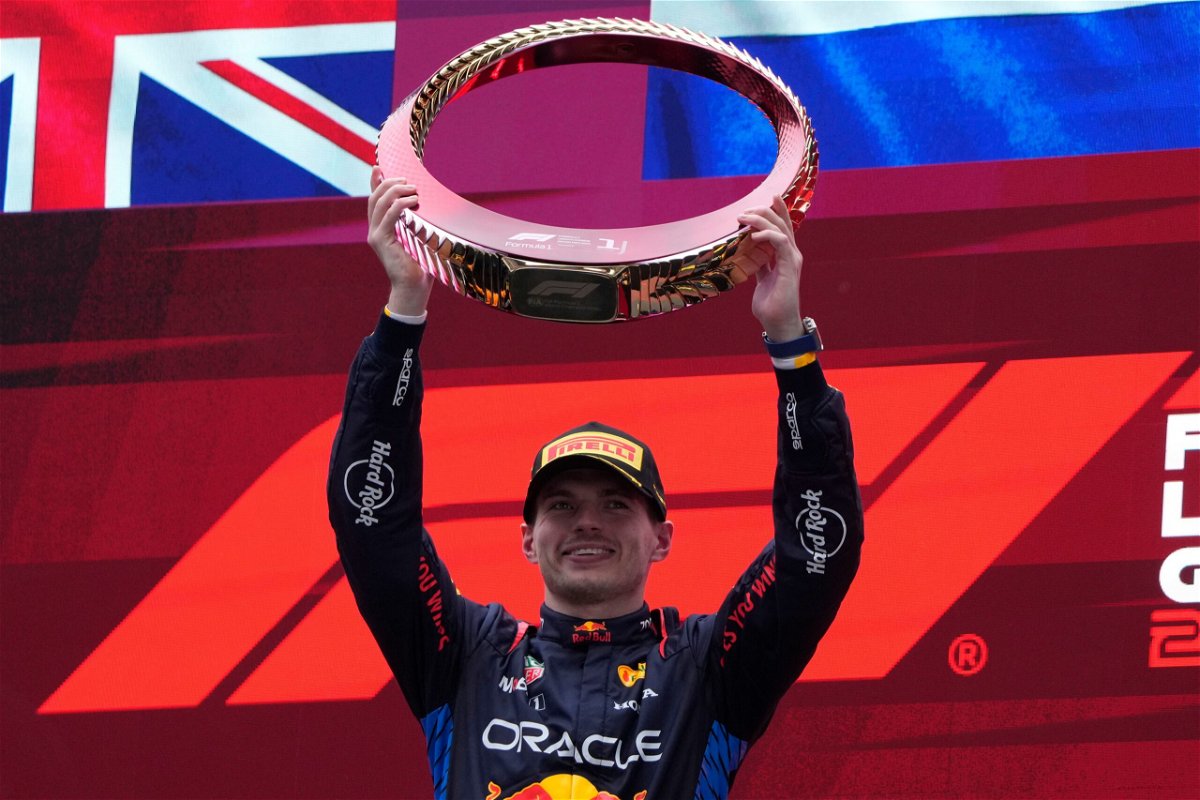 Red Bull driver Max Verstappen celebrates on the podium after winning the Chinese Grand Prix.