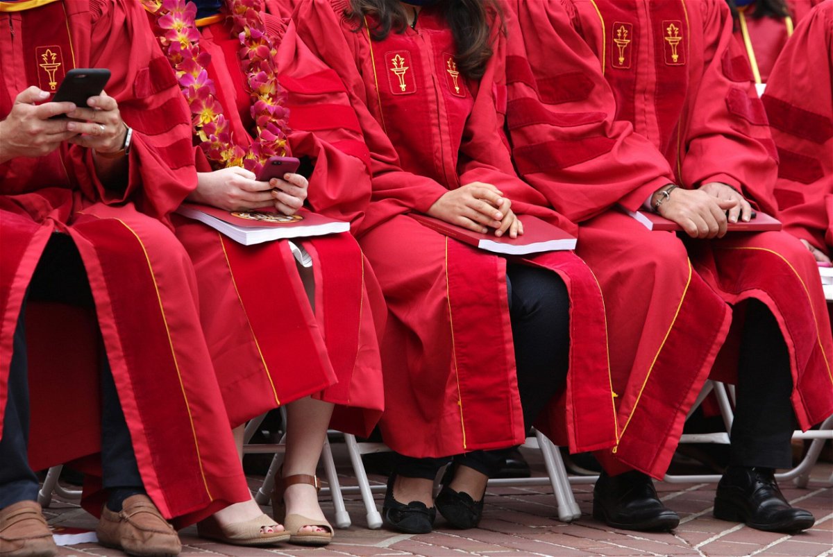 <i>Jerritt Clark/Getty Images/File via CNN Newsource</i><br/>Graduates attend the University Of Southern California's commencement in 2017 in Los Angeles.