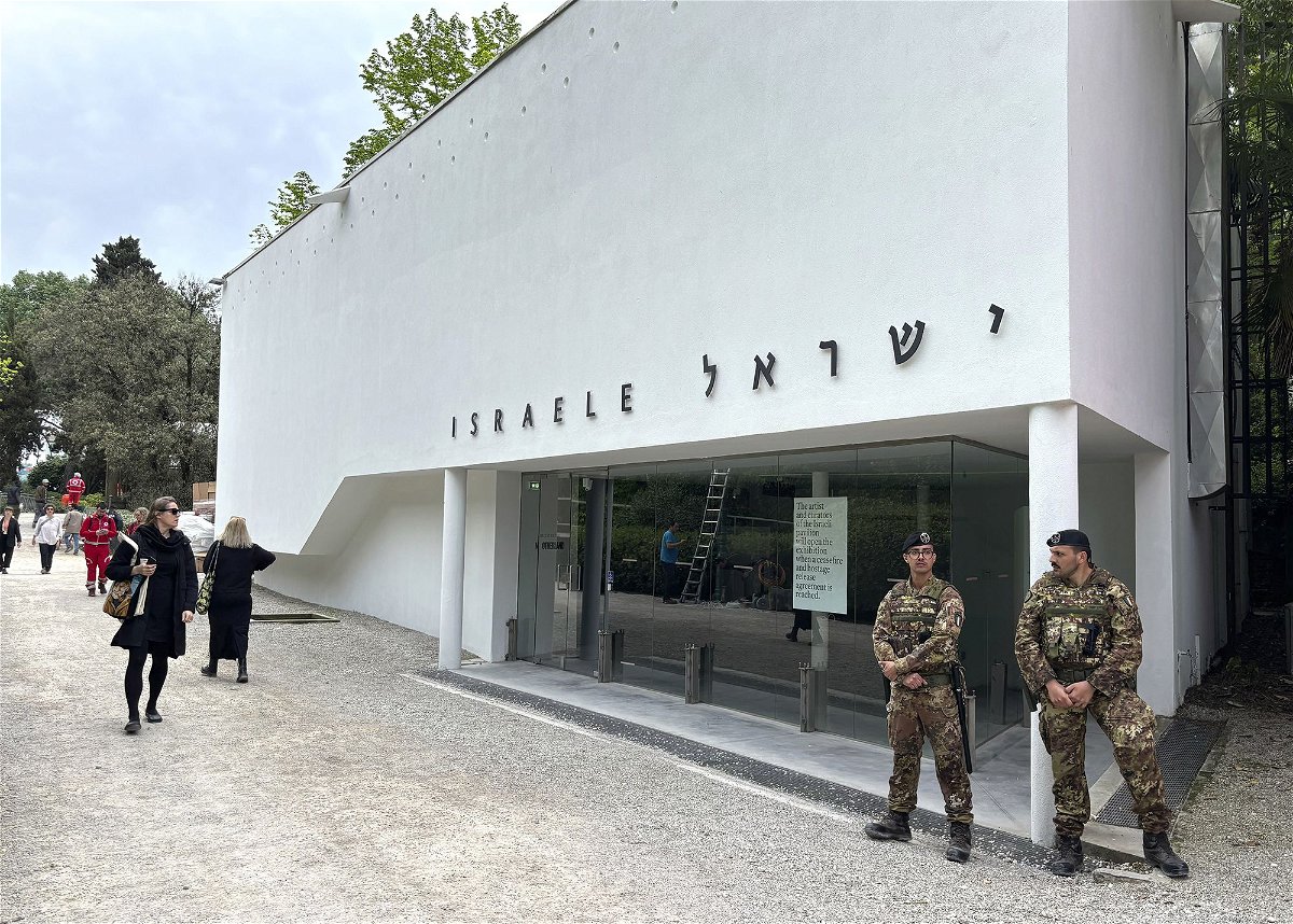 <i>Colleen Barry/AP via CNN Newsource</i><br/>Italian soldiers patrol the Israeli national pavilion at the Biennale contemporary art fair in Venice