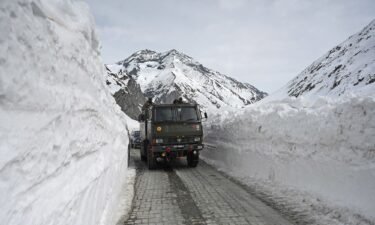 An Indian Army vehicle passes through the Zoji La mountain pass along a highway connecting Jammu and Kashmir to Ladakh.