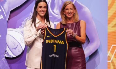 Caitlin Clark poses with WNBA commissioner Cathy Engelbert after she is selected with the No. 1 overall pick to the Indiana Fever.