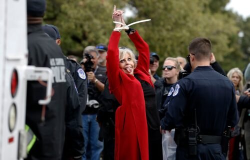 Fonda is taken away in ziptie handcuffs as she is arrested during a climate crisis protest at the US Capitol in October 2019.