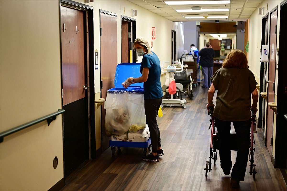 <i>Hyoung Chang/Denver Post/Getty Images via CNN Newsource</i><br/>An employee works at a Colorado nursing home.