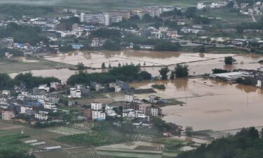 Village roads and farmlands are submerged in water after heavy rains in Qingyuan city