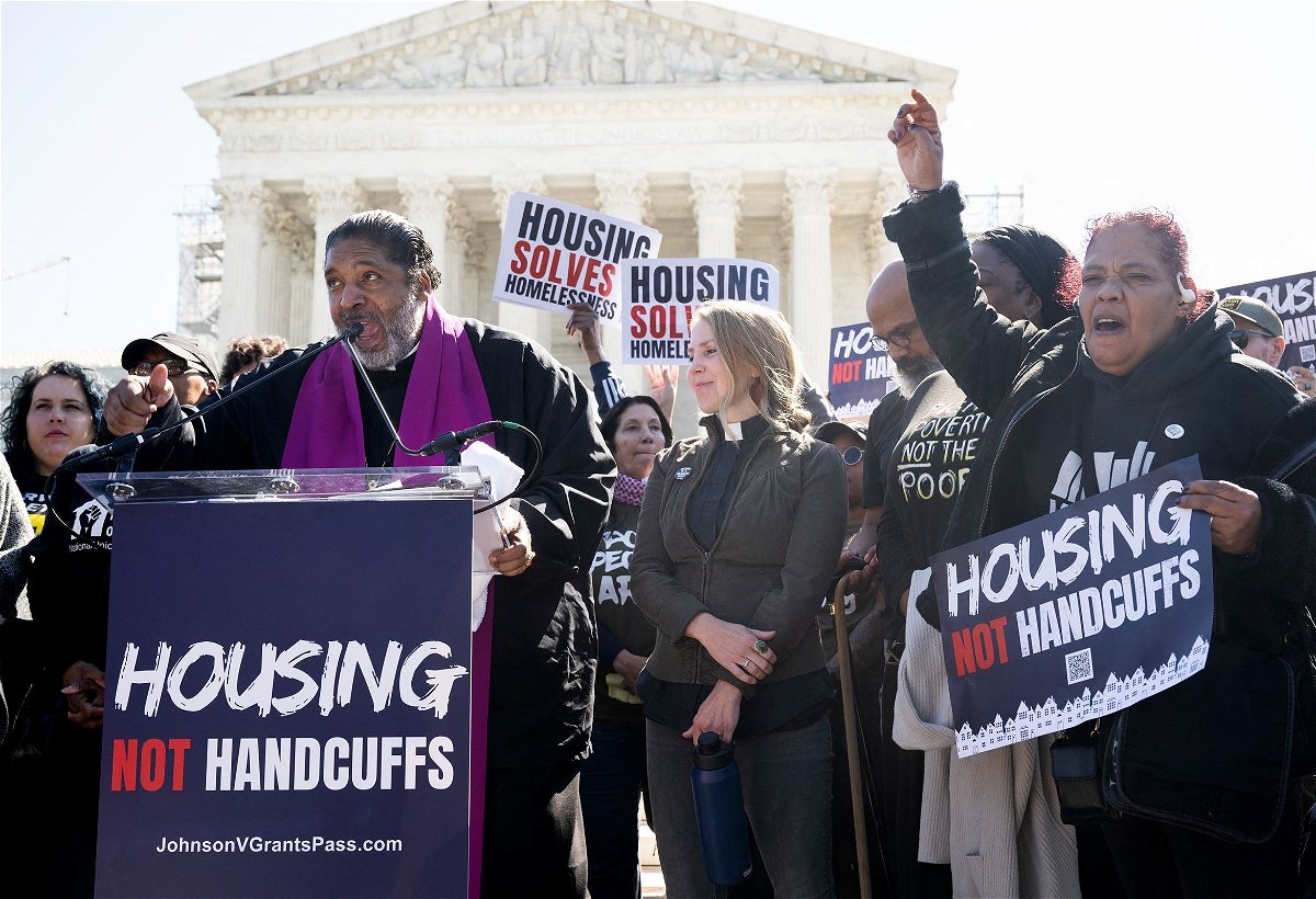 Rev. Dr. William J. Barber II speaks alongside demonstrators as they protest outside the US Supreme Court in support of the homeless as the Court hears the case of City of Grants Pass v. Johnson that could make it illegal to sleep outside
