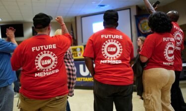 Volkswagen automobile plant employees celebrate winning a vote to join the UAW union Friday