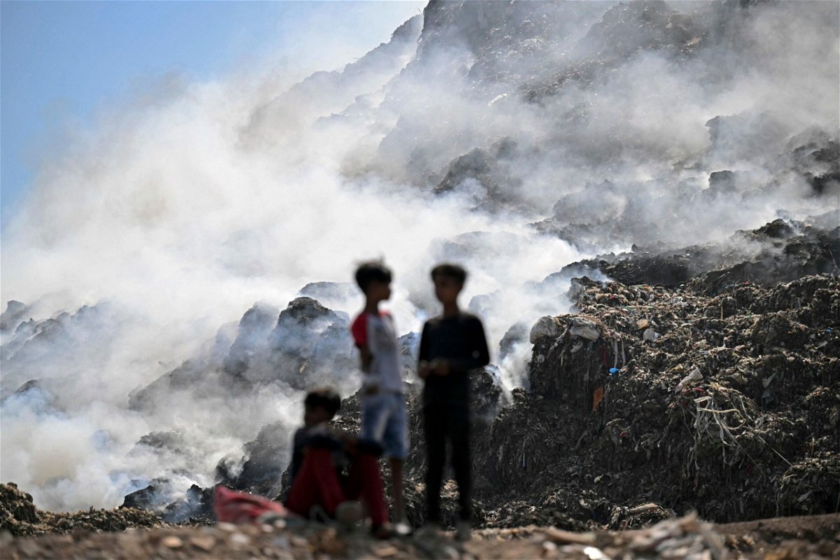 <i>Money Sharma/AFP/Getty Images via CNN Newsource</i><br/>Smoke billows from a fire that broke out at the Ghazipur landfill in New Delhi on April 22.
