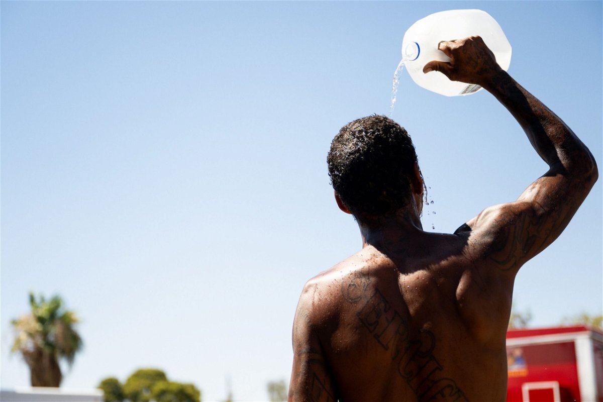 <i>Brandon Bell/Getty Images via CNN Newsource</i><br/>A person cools off amid searing heat in Phoenix