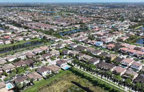 The current real estate business model is poised for a dramatic change. Homes sit on lots in a residential neighborhood on March 15
