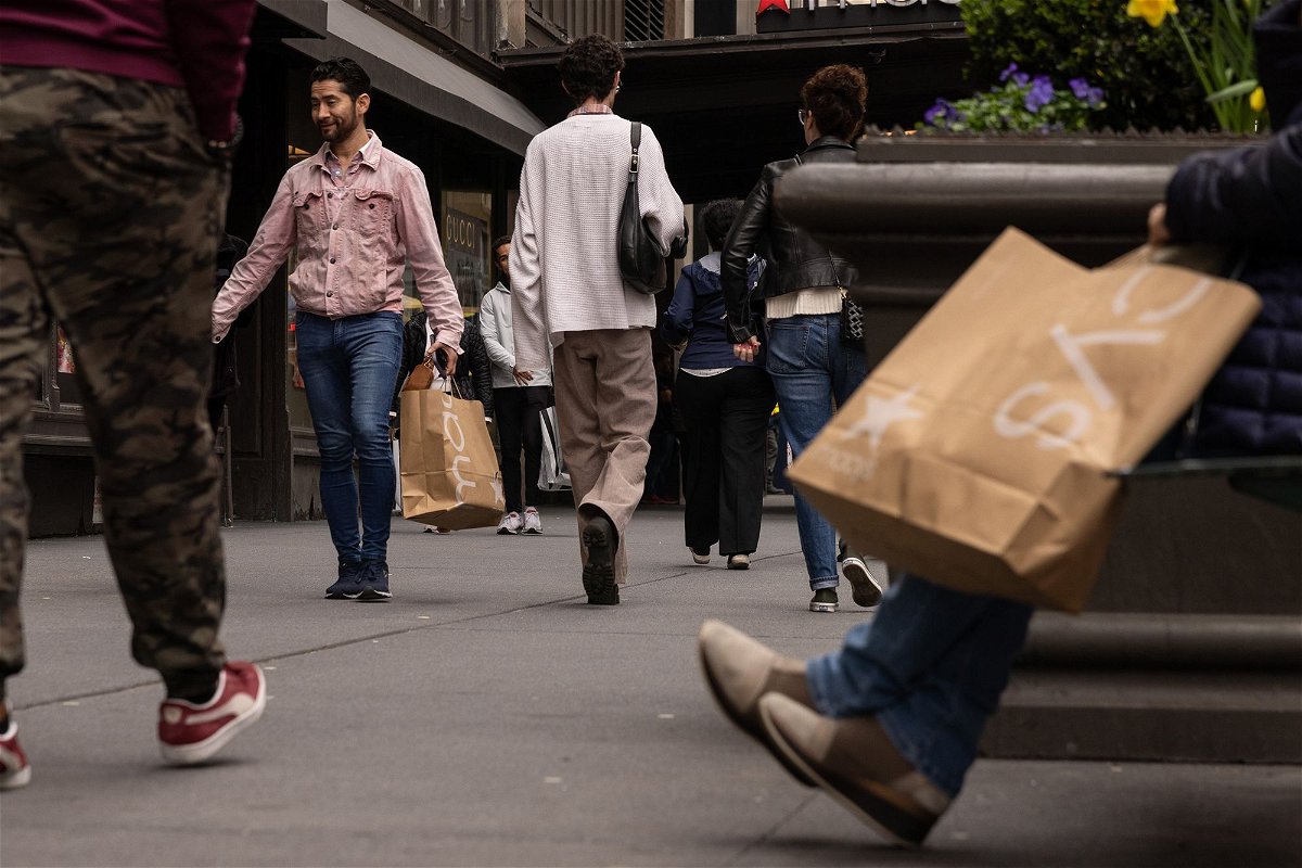 <i>Yuki Iwamura/Bloomberg/Getty Images via CNN Newsource</i><br/>Shoppers carry Macy's bags outside the company's flagship store in the Herald Square neighborhood of New York on April 11.