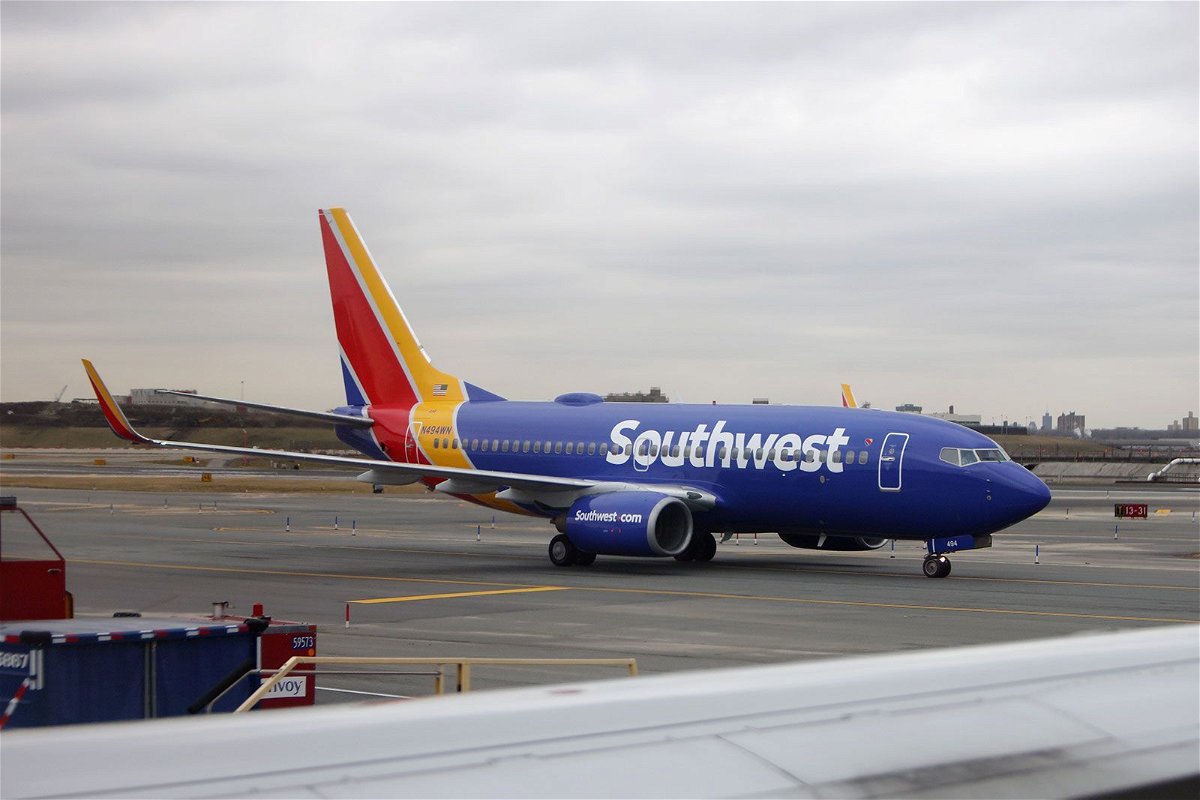 <i>Bruce Bennett/Getty Images/File via CNN Newsource</i><br/>A Southwest Airlines plane at LaGuardia Airport in New York. Southwest announced Thursday it is dropping services at four airports due to delays in deliveries of new jets by Boeing.