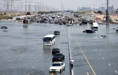 A general view of abandoned vehicles on a flooded highway can be seen on April 18