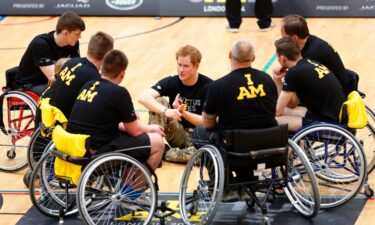 Prince Harry talks with wheelchair basketball players during the launch of the Invictus Games at the Copper Box Arena in London's Queen Elizabeth Olympic Park in March 2014.