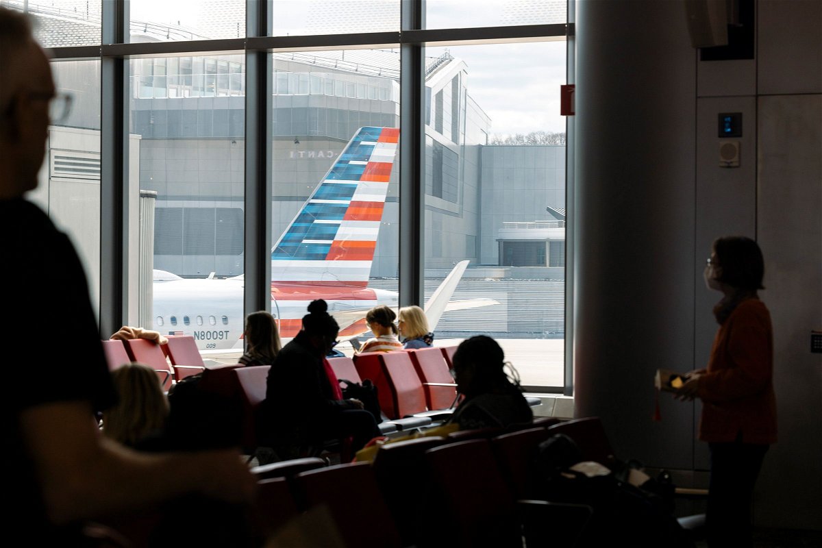<i>Angus Mordant/Bloomberg/Getty Images via CNN Newsource</i><br/>Passengers wait to board an American Airlines flight at LaGuardia Airport in New York City in April.