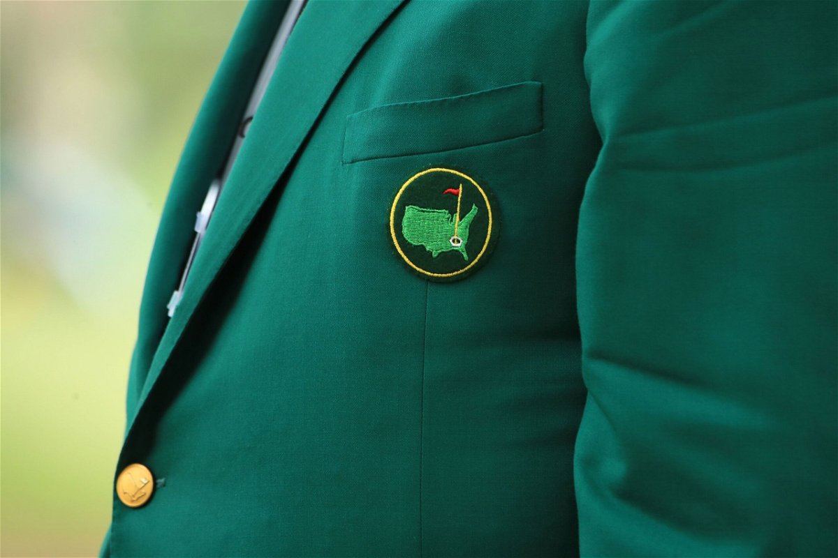 <i>TIMOTHY A. CLARY/AFP/AFP via Getty Images via CNN Newsource</i><br/>Faldo helps 1997 Masters champion Woods into his green jacket.