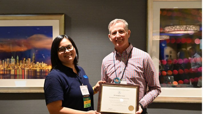 Deschutes County Performance Auditor, Aaron Kay (right) receiving the Distinguished Knighton Award on May 6.