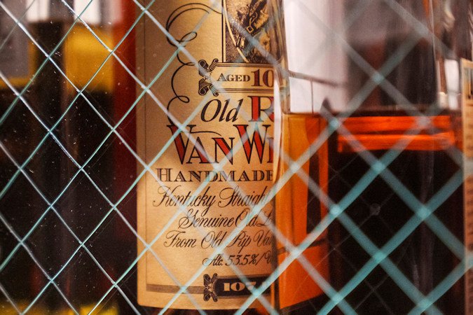 A bottle of Old Pappy Van Winkle bourbon, a 10-year-old, is shown behind glass doors at a whiskey bar, Saturday, March 4, 2023.