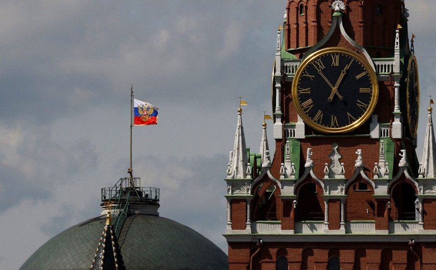The Russian flag flies on the dome of the Kremlin Senate building. An American soldier arrested in Russia on suspicion of theft will be detained for two months.
