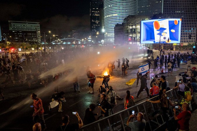 Police use water cannon to disperse demonstrators during a protest against Israeli Prime Minister Benjamin Netanyahu's government in Tel Aviv, Israel, on May 25.