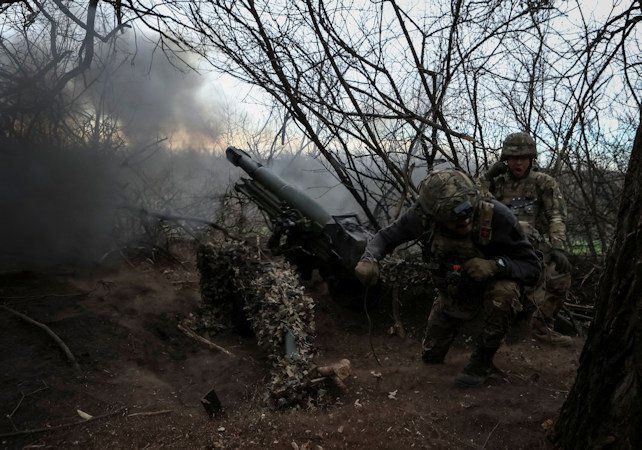 Servicemen of the 12th Special Forces Brigade Azov of the National Guard of Ukraine fire a howitzer toward Russian troops in Donetsk region, Ukraine, on April 5. The US announced on May 10 a new $400 million military aid package to Ukraine.