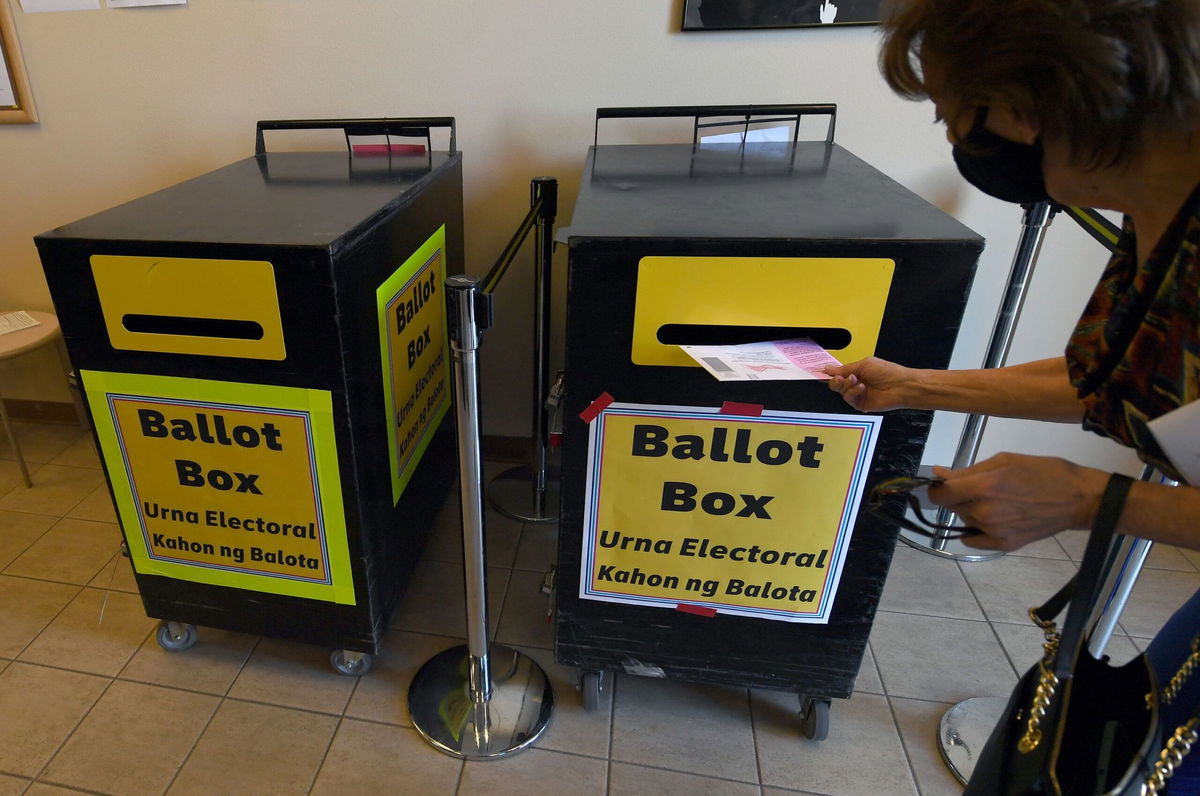 <i>Ethan Miller/Getty Images/File via CNN Newsource</i><br/>A voter puts a mail-in ballot in a ballot box at the Clark County Election Department