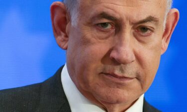 Israeli Prime Minister Benjamin Netanyahu addresses a conference in Jerusalem on February 18. Netanyahu on May 5 warned the International Criminal Court against potentially issuing arrest warrants against Israeli leaders and commanders.