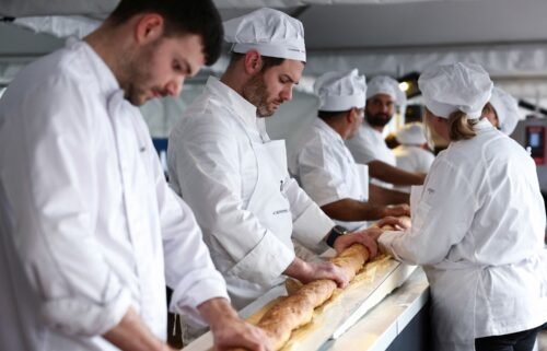 French bakers try not to crack the baguette when it comes out of a large rotating oven.