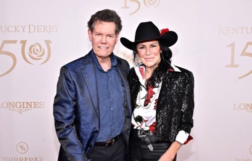 Randy Travis and Mary Davis attend the Kentucky Derby 150 at Churchill Downs on May 4 in Louisville